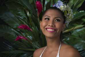 Beautiful Filipina young woman with flowers in her hair