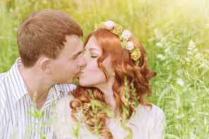 beautiful young couple kissing outdoors