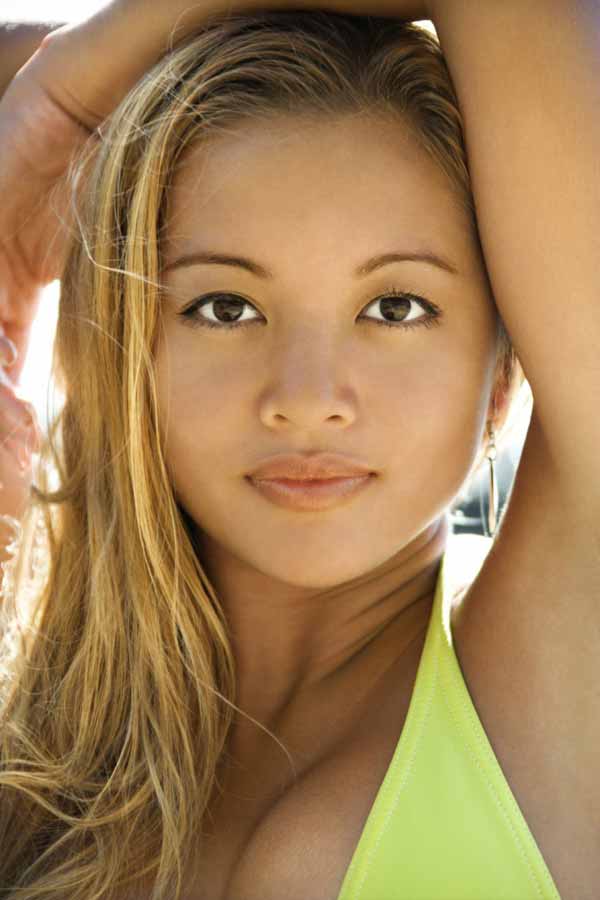 Beautiful young adult Asian Filipino female in swimsuit 