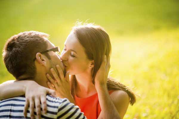 Romantic young couple hugging and kissing