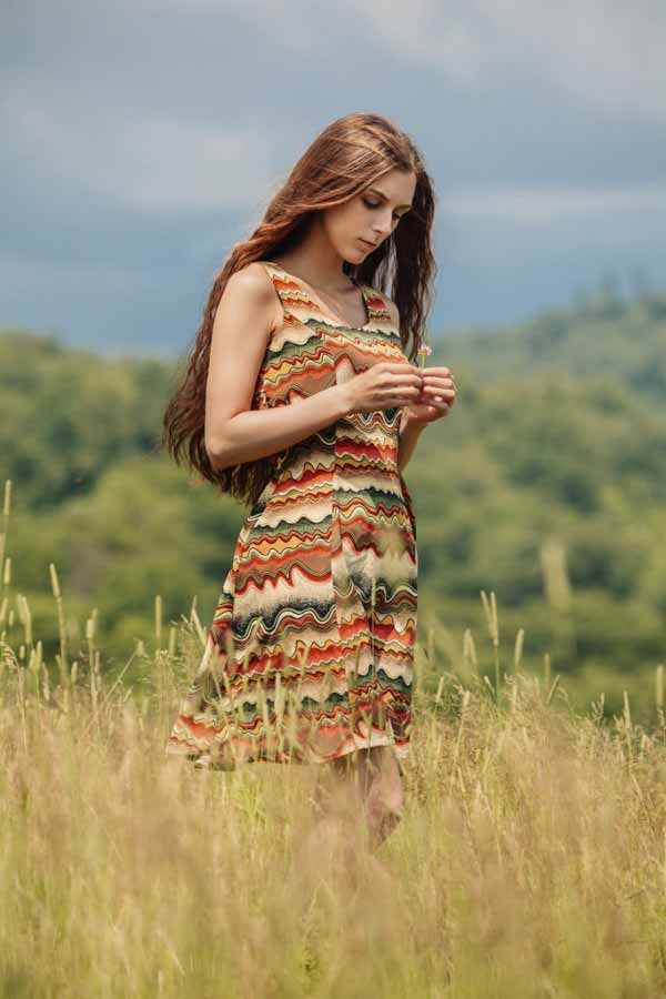 Russian woman walking in field. 