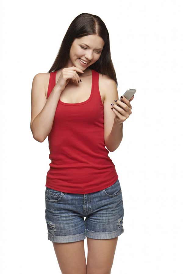 happy woman reading a sms on cell phone