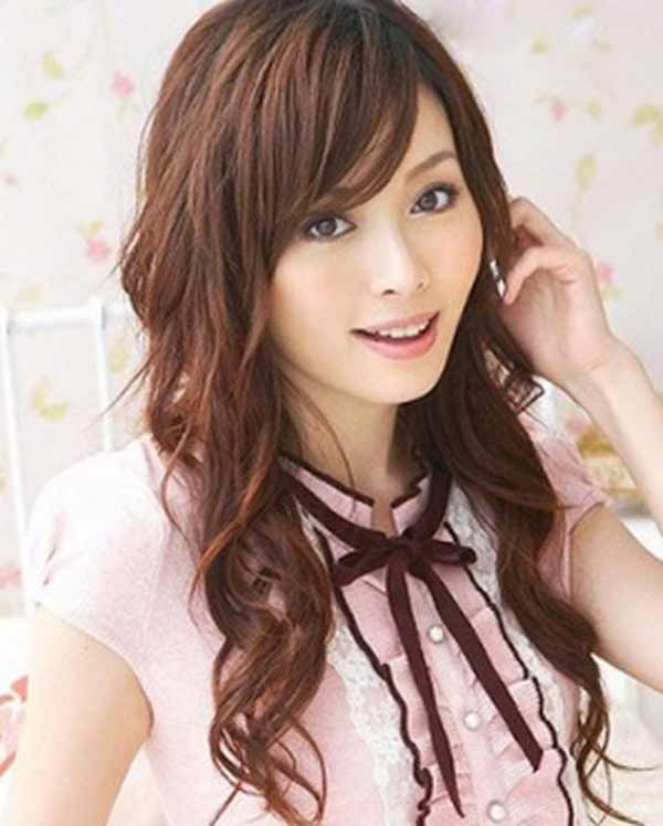 a very cute Japanese girl with long curly hair 
